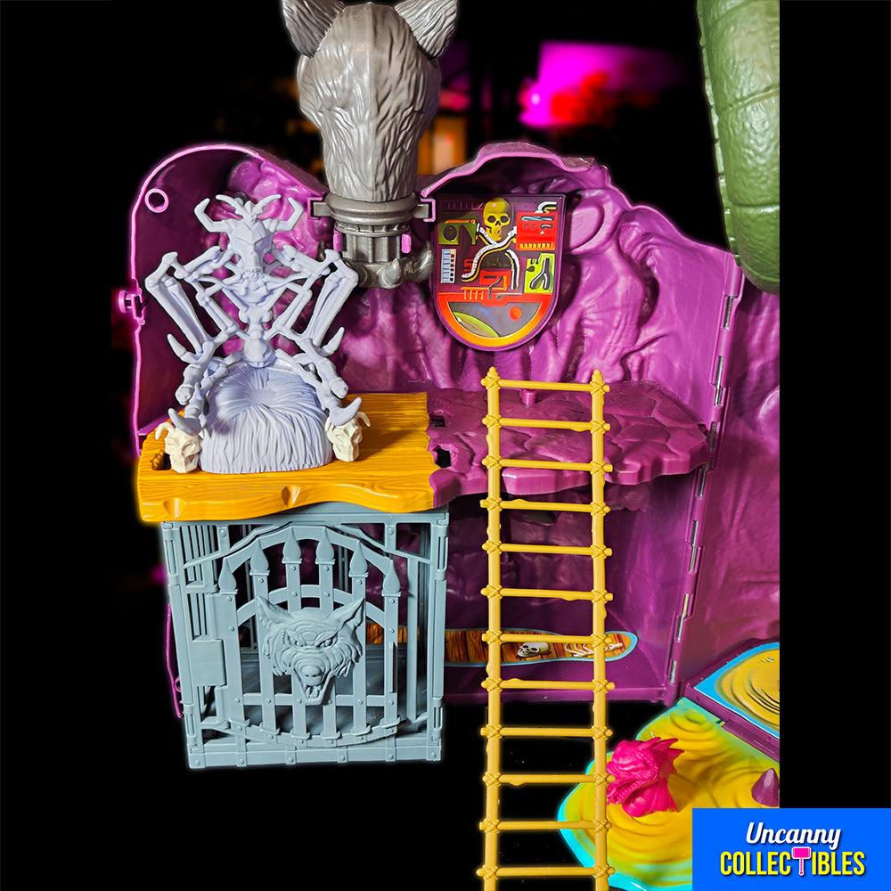 Mattel Masters of the Universe Origins Snake Mountain playset, grey castle with purple accents, snake head at top, wolf head entrance
