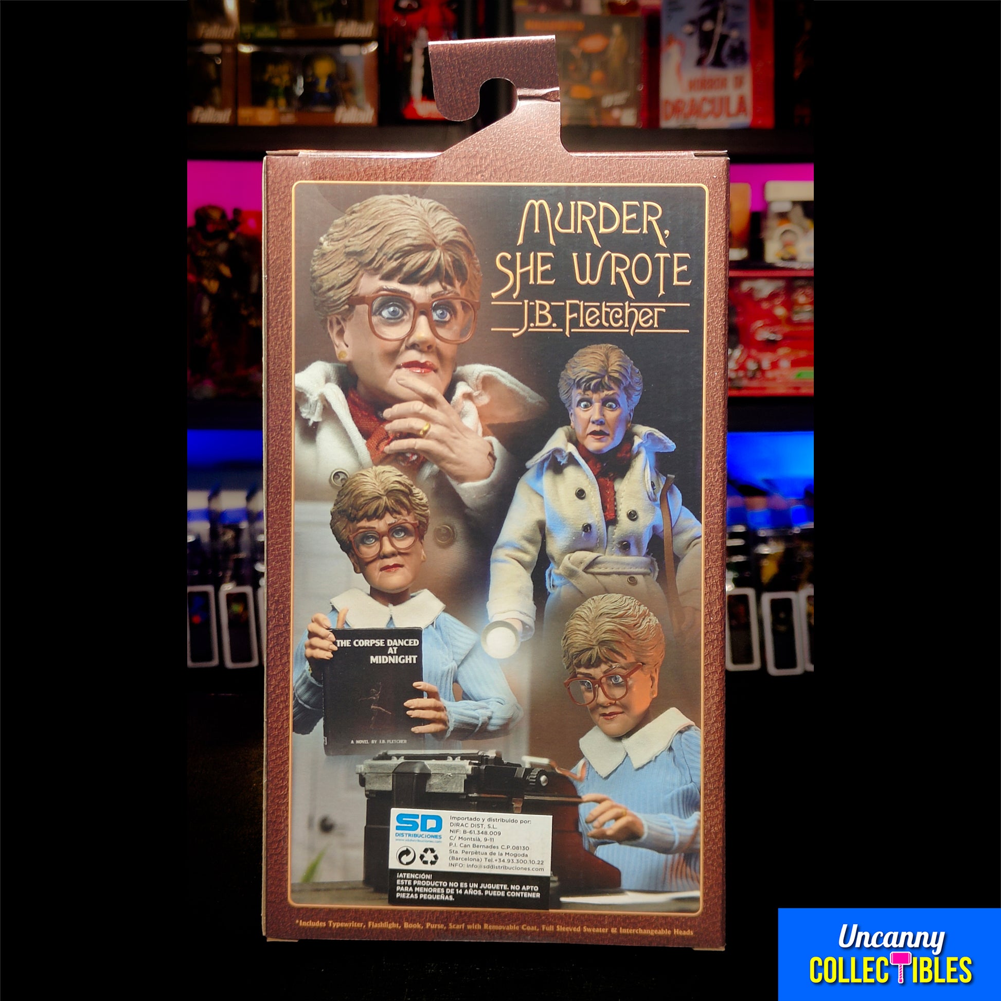 oxed NECA retro-style 8-inch action figure of Jessica Fletcher from Murder, She Wrote, featuring a cloth trench coat, alternate head, typewriter, and accessories, displayed against a collector shelf background.