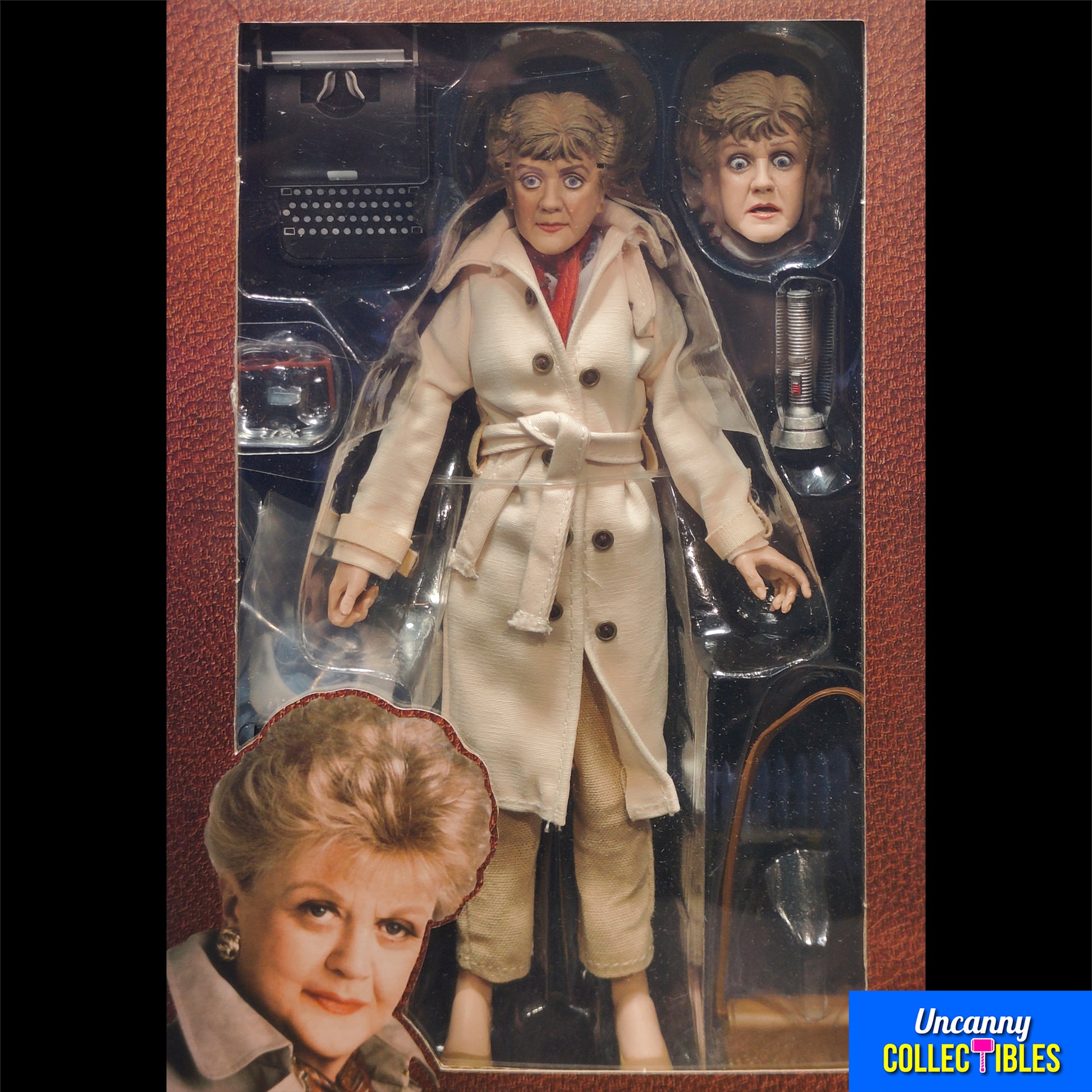 oxed NECA retro-style 8-inch action figure of Jessica Fletcher from Murder, She Wrote, featuring a cloth trench coat, alternate head, typewriter, and accessories, displayed against a collector shelf background.