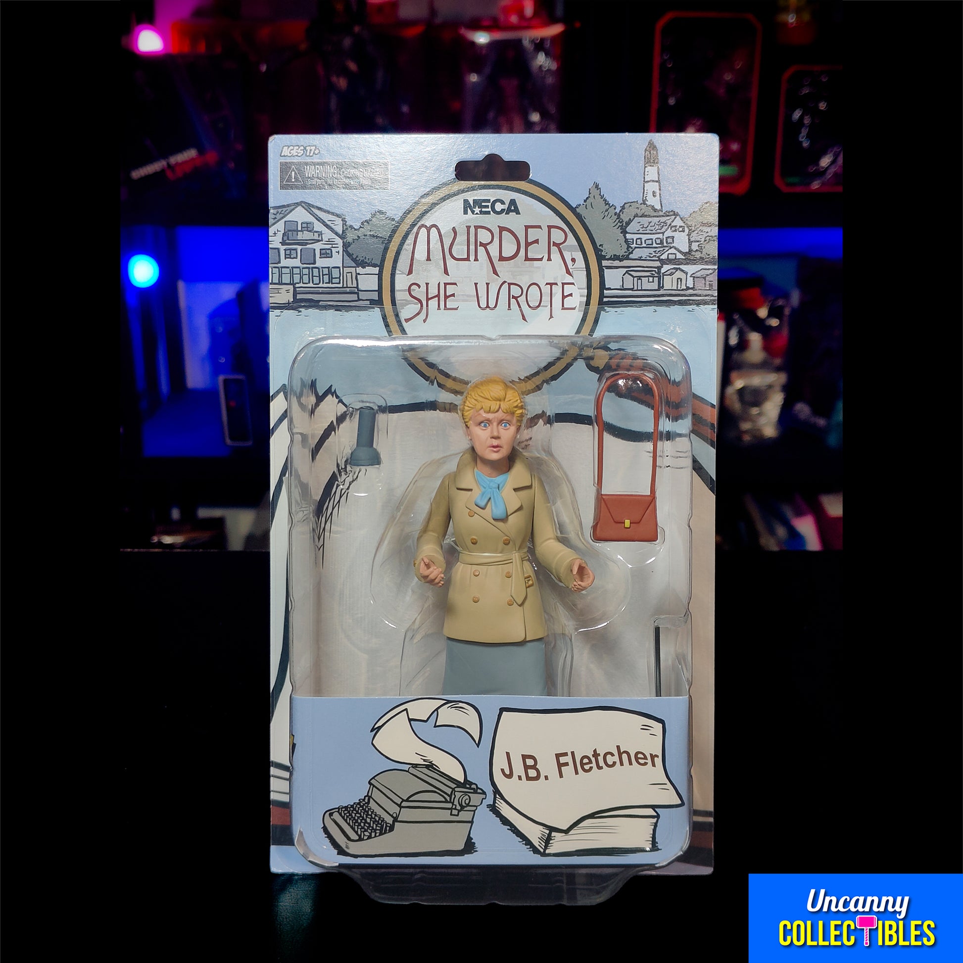 Carded NECA Toony Classics 15 cm figure of Jessica Fletcher from Murder, She Wrote, in a cartoon-style sculpt with a tan coat, blue scarf, brown handbag accessory, and illustrated backing card.