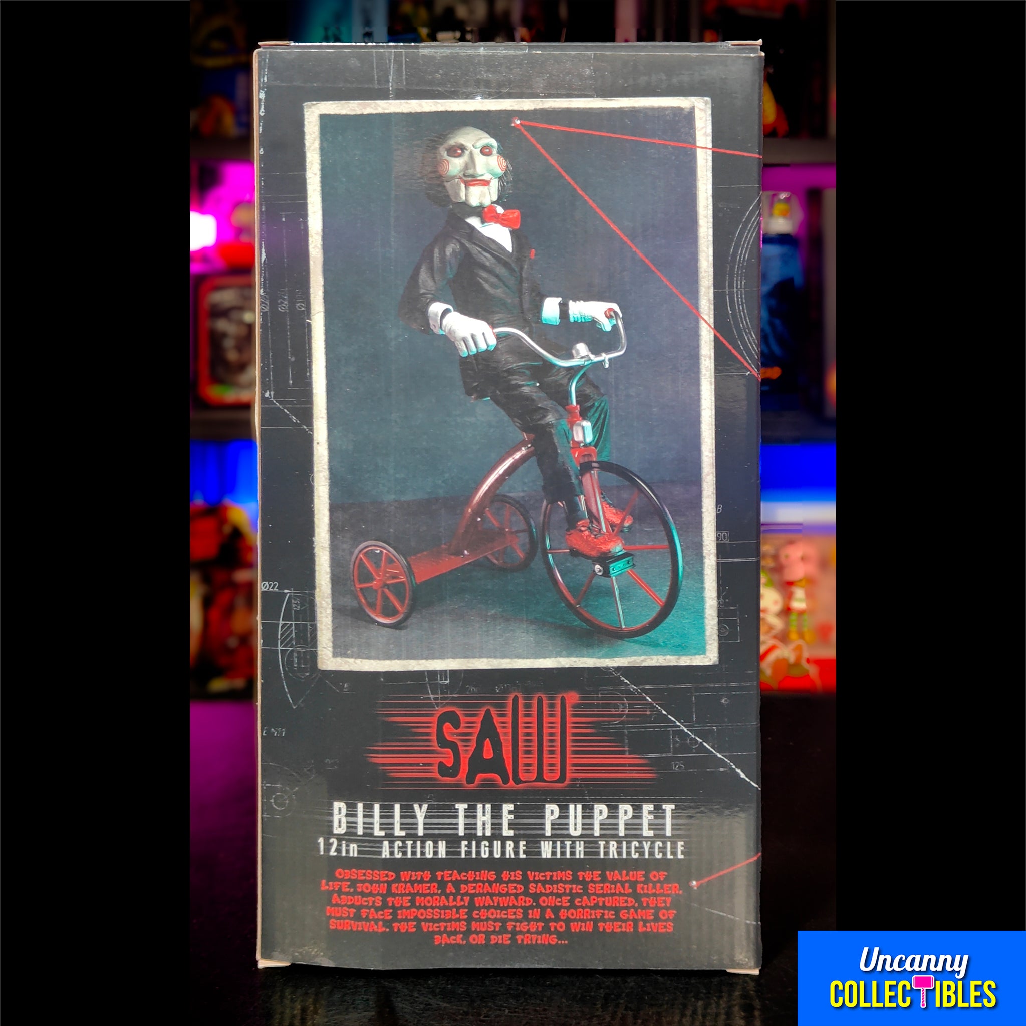 NECA Saw Billy The Puppet On Tricycle With Sound Action Figure – Saw, NECA, 30 cm, brand new collector item, Uncanny Collectibles Dublin Ireland